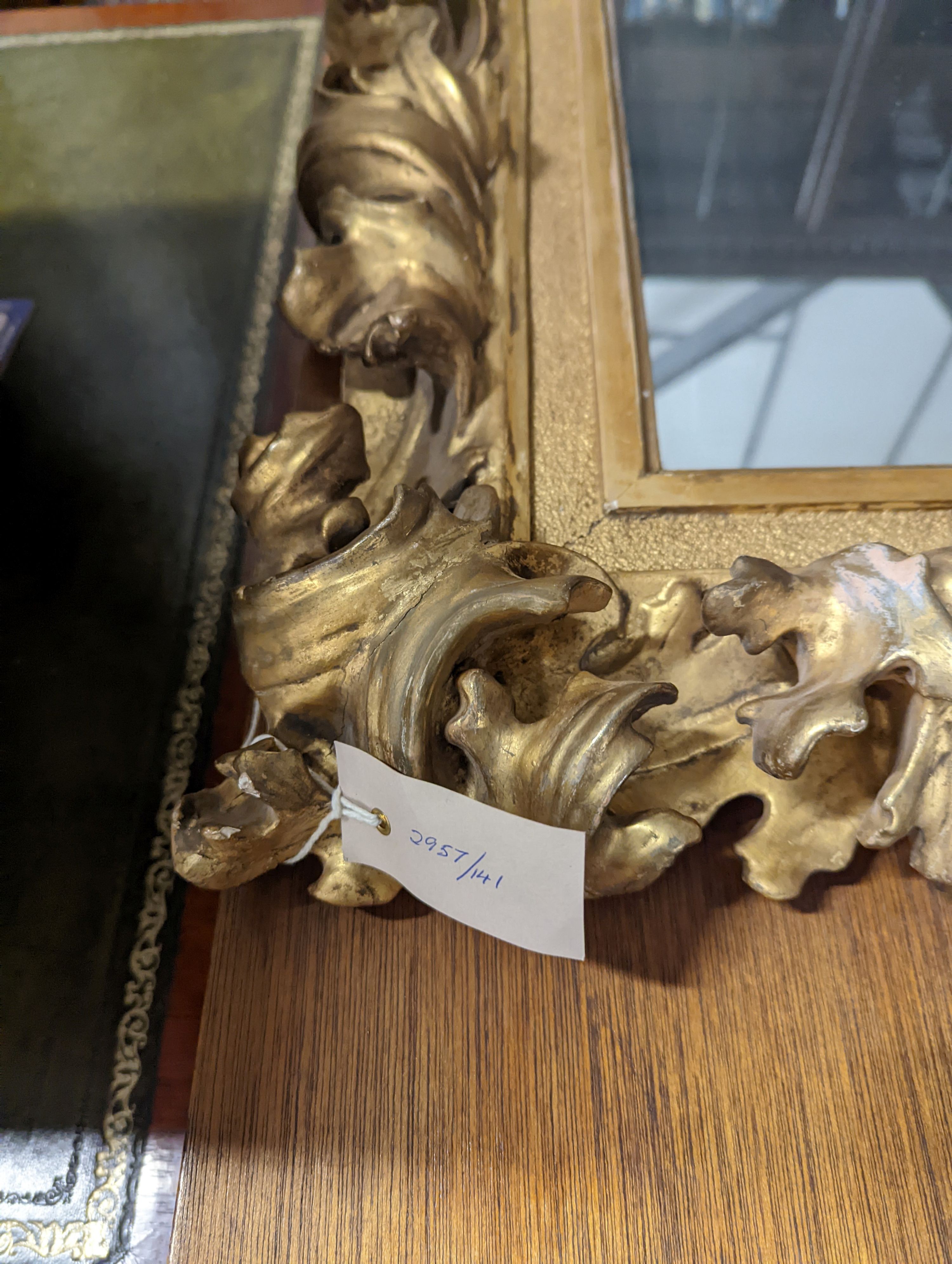 A large 19th century rectangular carved giltwood wall mirror with acanthus scroll frame, width 76cm, height 94cm